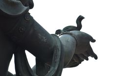 a close up view of a statue's arm and leg