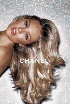 a woman with long blonde hair is posing for the cover of chanel's new album