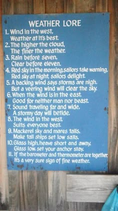 a poem written on a wooden wall in front of a blue sign that says weather lore