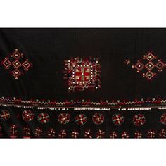 This fabulous antique Kohistani shawl whispers stories of the Mangal people, inhabiting the borderlands of eastern Afghanistan and western Pakistan. This antique shawl was Traditionally worn by women as a head covering during wedding or ceremonies, this piece is a testament to the Mangal's artistry and cultural heritage. Hand-crafted from heavy black cotton, the shawl is adorned with intricate silk embroidery. Geometric and floral motifs in vibrant colors like red, green and yellow dance across Traditional Pashmina Dupatta For Ceremonial Use, Traditional Pashmina Dupatta For Ceremonial Occasions, Folk Style Dupatta With Traditional Patterns For Eid, Ceremonial Shawl With Motifs, Traditional Drape Shawl With Motifs For Ceremonies, Traditional Draped Shawl With Motifs For Ceremonies, Ceremonial Shawl With Embroidered Border And Traditional Drape, Pashmina Shawl With Motifs For Traditional Ceremonies, Traditional Resham Embroidery Dupatta For Rituals