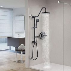 the shower head and handset are shown in this modern bathroom