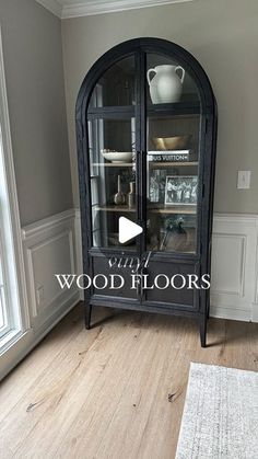 an empty living room with wood floors and glass doors on the front door is featured in this video