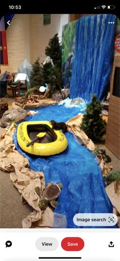 an inflatable raft floating on top of a river next to a christmas tree