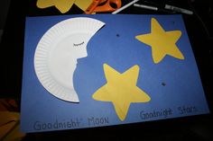 paper plate moon and stars on blue background with scissors next to it that says goodnight star