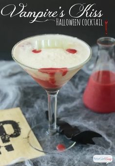 These Vampire's Kiss Halloween cocktails only look sinister! But they taste delicious. Blood-red strawberry puree pierces a creamy white homemade pina colada, in this spooky take on the popular Hawaiian Lava Flow cocktail. The right garnishes and props, like vampire teeth, plastic bats, spiderwebs and a beaker filled with strawberry puree turn it into a spooky Halloween mixed drink. #ad #donthesitaste Halloween Beverages, Vampires Kiss, Homemade Pina Colada, Kiss Cocktail, Halloween Cocktail Party, Vampire Kiss, Halloween Punch, Rum Cream, Vampire Halloween