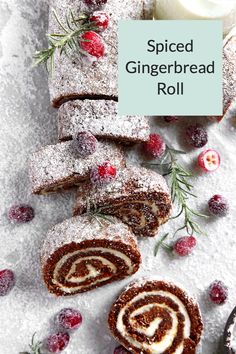 sliced gingerbread roll with cranberries and powdered sugar