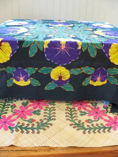 an image of a table cloth with flowers on it