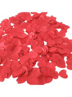 red heart shaped confetti on white background