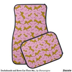 two pink and yellow dog print car mats