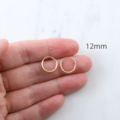 1 Pair 14k Gold Filled Small Endless Hoops Hoop Earrings Shop our medium gold filled hoops: https://etsy.me/2RGM50A Shop our large gold filled hoops: https://etsy.me/2t4HueX NO RETURNS ON EARRINGS - for sanitation reasons Turquoise gem in video : https://www.etsy.com/listing/786511397/ ✦ Quantity: 2 pieces (1 pair) ✦ Material: 14k gold filled ✦ Dimensions: 9mm, 12mm, 14mm, 16mm (1.25mm thick) ✦ Surface: shiny gold ** Please note that not all charms will slide onto these hoops. You may need jump 14k Gold Halo Huggie Earrings, 14k Gold Round Huggie Earrings With Halo, 14k Gold Round Halo Huggie Earrings, Internally Threaded Hoop Earrings As A Gift, Nickel Free 14k Gold Round Huggie Earrings, Hypoallergenic 14k Gold Round Cartilage Earrings, Nickel-free 14k Gold Cartilage Earrings, Earrings Gold Hoops, Turquoise Gem