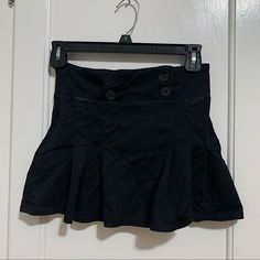 Black Mini Skirt With Button Detail. Never Worn. Casual Mini Skirt With Button Closure For Night Out, Black Mini Bottoms With Buttons, Black Mini Skort With Buttons, Black High Waist Mini Skirt With Buttons, High Waist Black Mini Skirt With Buttons, Black Mini Length Bottoms With Buttons, Black Mini Skirt With Button Closure, Chic Black Mini Skirt With Buttons, Black Mini Skirt With Button Closure For Night Out