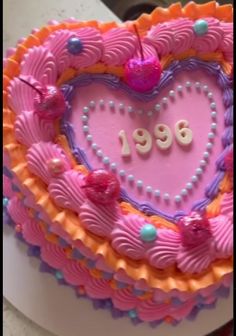 a heart shaped cake with the number 1989 on it