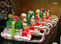 candy canes are lined up on top of each other and wrapped in christmas ribbon