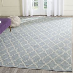 a blue and white rug in a living room