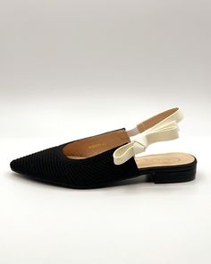 This woven slingback with stretchable fabric and stretchy ribbon detail will be your favorite for years to come. They feature a lightly padded footbed with a classic pointed toe. We recommend sizing up a half size. Vegan leather lining .75" heel Slingback Flats, Dressed To The Nines, Shoe Gifts, Blackbird, European Summer, Pretty Shoes, Black Bird, Shoe Collection, Vegan Leather