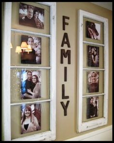 family pictures are hung on the wall behind windows