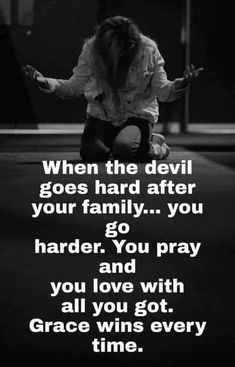 a woman kneeling down with her arms spread out in front of her and the words when the devil goes hard after your family you go harder, and pray