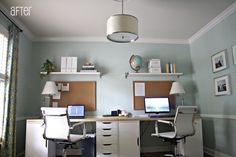 a home office with two computers on the desk