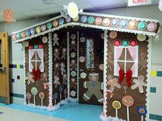 a building made out of gingerbreads and candy canes with decorations on it