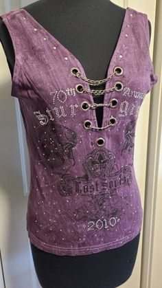 70th annual Sturgis motorcycle rally original tank top with open back, skulls, chains, and rhinestones. Size medium. Such a cool, unique tank top! Gothic Sleeveless Top With Skull Print, Y2k Sleeveless Festival Tops, Y2k Sleeveless Tops For Festival, Fitted Sleeveless Biker Top, Y2k Festival Sleeveless Tank Top, Y2k Sleeveless Festival Tank Top, Y2k Sleeveless Tank Top For Festivals, Gothic Sleeveless Tops For Festivals, Punk Style Tank Top For Festivals