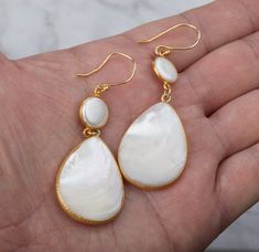 A pair of two tier natural Mother of Pearl set in gold vermail (gold lated over sterling silver) bezel:1. Stone : Mother of Pearl (natural gemstone)2. Stone shape and size:        top: round 11 mm across       bottom: pear 35 x 27 mm3. earring total length ~68 mm4. bezel material: sterling silver or gold vermail (gold over sterling silver)5. earring hook: sterling silver or gold vermail 6. an optional custom note card, printed with your personalized message on heavy weight cardstock, in elegant Mother Of Pearl Earrings With High Luster For Gifts, Mother Of Pearl Drop Earrings For Gifts, Mother Of Pearl Drop Jewelry For Gift, Drop-shaped Mother Of Pearl Jewelry For Gifts, High Luster Drop Earrings For Gift, Teardrop Mother Of Pearl Earrings As Gift, Teardrop Mother Of Pearl Earrings For Gift, Handmade Long Drop Pearl Earrings As Gift, Handmade Long Drop Pearl Earrings For Gifts