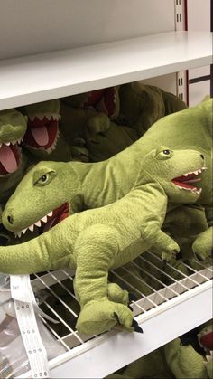 stuffed alligators are on shelves in a store