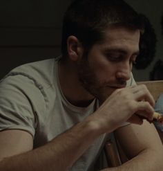 a man sitting at a table eating food