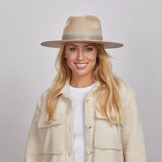 Maldives Moon | Womens Wide Brim Felt Fedora Hat blends elegance with a hint of adventure. Made from firm Australian felt wool, this safari-style hat features a cotton web band with twine overlay, adding unique texture and style—perfect for women seeking a bold, refined look. Material: Mid-weight Firm Australian Felt Wool Shape: Safari Trim: Mexican Geometric-tribal Print Ribbon Band and Twine String Overlay Brim Size: 3 1/2" Crown Height: 4" Sweatband: Adjustable Velcro Sweatband Imported Wide Brim Felt Hat, American Hat Makers, Patriotic Hats, Black Cowgirl, Felt Cowboy Hats, Trim Styles, Festival Hat, Black Cowboy, Pink Cowgirl