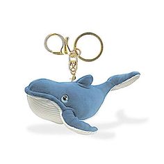 a keychain with a dolphin on it's side and an eyeball in the shape of a whale