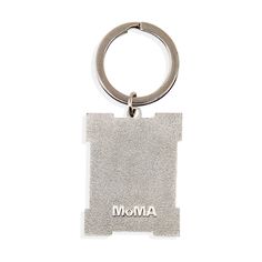 a metal keychain with the word mom written in silver on it's side