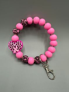 Raise your hand if you are tired of searching in your purse for your keys!  Or if you hate the juggle of your keys being in the wrong pocket and your hands are full!   These bracelet keychains are saving me headaches & eliminating the juggle! The keychain is made of high quality, non-toxic, BPA free silicone beads. Attached to a metal ring and lobster clasp to easily attach to your keys. The wristlet is designed to easily slip onto your wrist, and is the perfect size that it will stay there unti Bracelet Keychains, Bracelet Keychain, House Door, Key Accessories, Wristlet Keychain, Metal Ring, Silicone Beads, Metal Rings, Spacer Beads