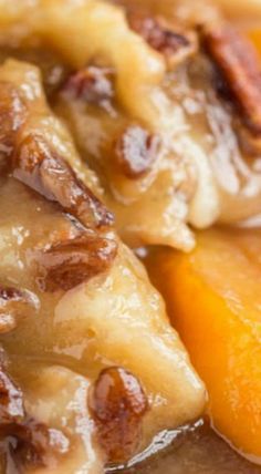 a close up of food on a plate with oranges and pecans in it