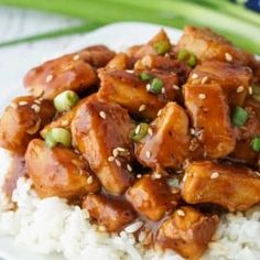 a white plate topped with chicken and rice