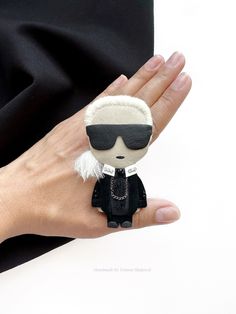 Karl Lagerfeld - a small black fashion designer brooch handmade from environmentally friendly materials: black Italian leather and fur .  Brooch size 3.5 inches, weight 12 grams. The brooch is fastened on a jacket, sweater, dress, cardigan, fabric bag. This women fashion brooch is the perfect stylish gift for lovers of handmade things. Care instructions: do not wash  Dry clean only  Karl Lagerfeld Lagerfeld brooch Lagerfeld vintage black brooch men black fashion fashion designer vintage brooch g Black Lapel Pin Brooch For Gift, Black Lapel Pin Brooch As Gift, Black Brooch Lapel Pin As Gift, Luxury Black Brooch For Evening, Vintage Black Brooch Lapel Pin, Vintage Black Lapel Pin For Gift, Vintage Black Lapel Pin As Gift, Black Vintage Lapel Pin For Gift, Handmade Elegant Black Brooches