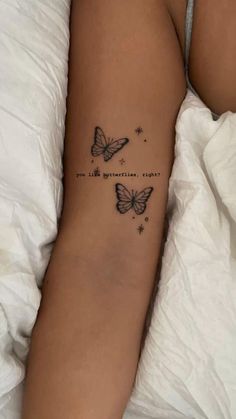 a woman's arm with two butterflies and the words, i am so beautiful