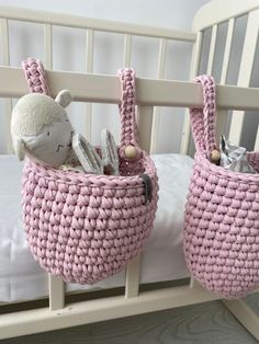 two crocheted baskets with stuffed animals in them