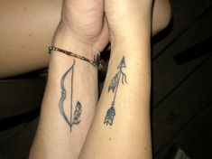 two people with matching tattoos on their arms