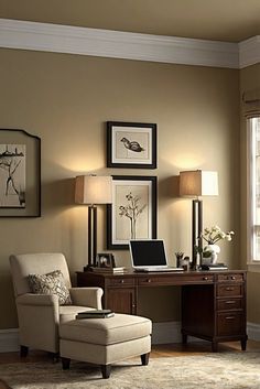 a living room with a chair, desk and pictures on the wall above it in front of a window