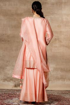 Peach kurta with placement floral motifs. Comes with sharara pants and organza dupatta.
Components: 3
Fabric: Chanderi, Organza
Neckline: Round
Sleeve Length: Full
Color: Peach
Embroidered
Dupatta with tassels
Laced border
Closure: Kurta: Front buttons - Aza Fashions Unstitched Silk Sharara For Festive Occasions, Silk Sharara With Sheer Dupatta And Straight Kurta, Silk Sharara With Straight Kurta And Resham Embroidery, Silk Sharara With Resham Embroidery And Straight Kurta, Silk Anarkali Style Sharara, Unstitched Anarkali Silk Sharara, Unstitched Silk Anarkali Sharara, Embroidered Cotton Silk Sharara For Wedding, Semi-stitched Silk Sharara With Chikankari Embroidery