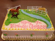 a birthday cake with horses on it