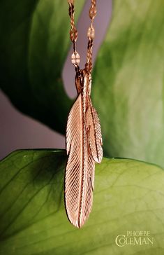 18ct rose gold necklace with two engraved feather charms on a petal chain. Elegant Peacock Pendant Necklace, Swan Pendant Gold, Gold Plated Gemstone Necklace Hummingbird, Peacock Feather Pendant, Gold Wing-shaped Sterling Silver Necklace