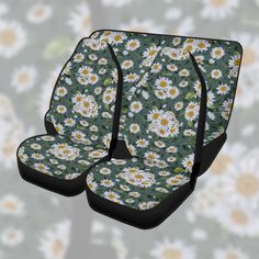 the front and back seat covers are covered in daisies, with black straps on each side