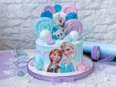 there is a frozen princess cake on the table