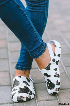 Olivia Mark - Classic Clogs with White Cow Spots Print Trendy Non-slip Clogs With Round Toe, Spring Non-slip Flat Heel Clogs, Trendy Non-slip Closed Toe Clogs, Casual White Synthetic Mules, Trendy Non-slip Slip-on Clogs, Casual White Mules With Round Toe, Casual White Round Toe Mules, Trendy Non-slip Round Toe Clogs, Casual Synthetic Closed Toe Clogs