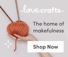 a hand holding a ball of yarn with the words lovecrafts in front of it