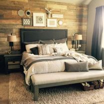 a large bed sitting in a bedroom on top of a carpeted floor next to a window