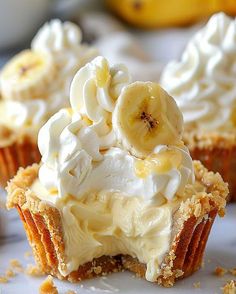 banana cream cupcakes on a plate with bananas in the background