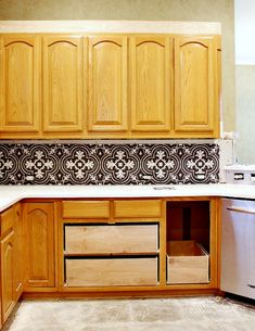 a kitchen with wooden cabinets and white counter tops