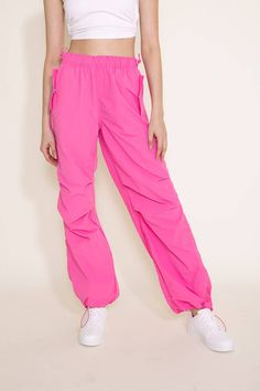 Step up your athletic game this with these Love Tree Nylon Baggy Parachute Pants for Women in Pink. These pants feature a comfy parachute design, elastic waistband, and side pockets to keep you comfortable all day long. These are going to be your new favorite pair of pants! Features: Love Tree Style: 6853PH-PINK Color: Pink 100% Nylon Women’s pants Side pockets Elastic waistband Moisture wicking Measurements from size small: Waist: 26” Front Rise: 11” Back rise: 13” Inseam: 31" Machine wash cold