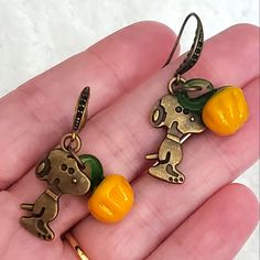 These Are Handmade By Me In My Jewelry Studio, These Are Bronze Snoopy Dogs, Bronze Ear Hooks With A Swirl Design See Photos Closely, I Have Added Murano Glass Pumpkins To These, To Go With The The Great Pumpkin, Charlie Brown! Theme. The Little Pumpkins Are Super Cute With Green Stems. These Are 1.5" Long And Dangle. I Have A Few Of These But Not Many, Perfect To Wear For Halloween, Thanksgiving And All Fall Long! Listing Vintage And New Jewelry Daily, Bundle And Save, Reasonable Offers Welcome The Great Pumpkin Patch, Snoopy Pumpkin, Vintage Charlie Brown, The Great Pumpkin Charlie Brown, Great Pumpkin Charlie Brown, The Great Pumpkin, Great Pumpkin, Bottle Earrings, Brown Earrings